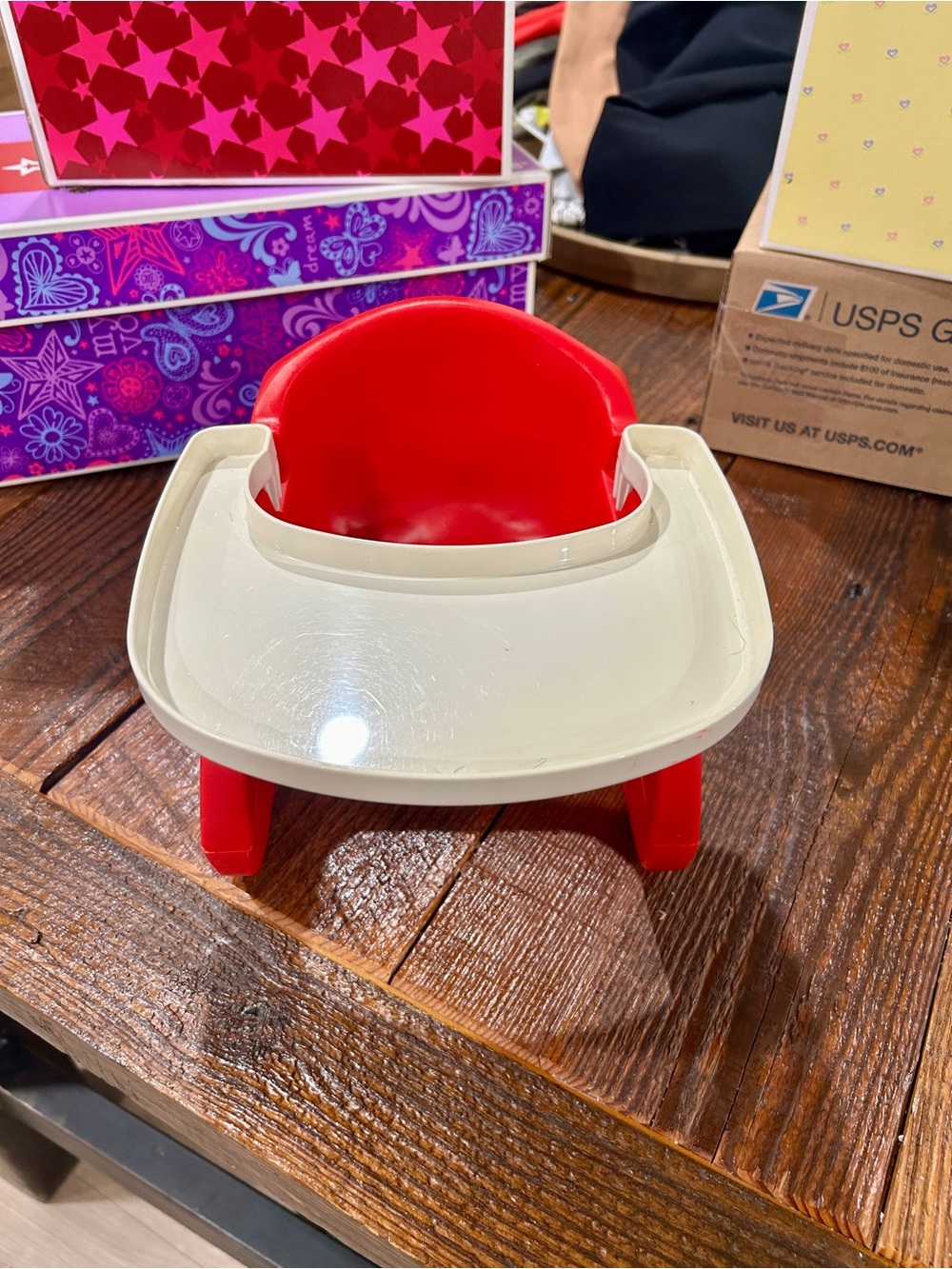 American Girl Bitty Baby red booster seat.